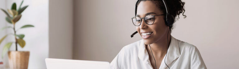 Woman wearing headset have meeting online, video conferencing